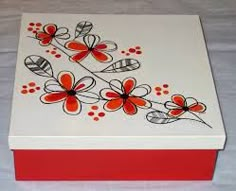 a red and white box with flowers painted on it