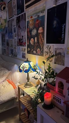 a bed room with a neatly made bed and lots of pictures on the wall