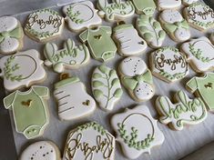 many decorated cookies sitting on top of a cookie sheet