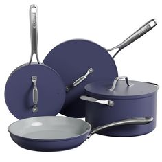 an assortment of pots and pans with tongs