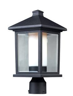 a black post light with two white lights on it