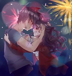 two people are hugging in front of fireworks