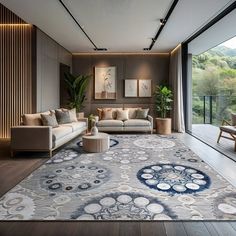 a living room filled with furniture and a large rug on top of a hard wood floor