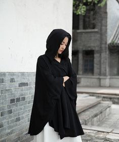 Are you ready to make a statement with your outfit? Look no further than our Retro Style Linen Witch Cloak with Bat Sleeves! This versatile and chic cape coat is a must-have for anyone looking to elevate their wardrobe. Key Features: Made from high-quality linen fabric for comfort and durability Elegant awning type design with a hooded collar for extra sun protection Unique long bat sleeves for a trendy twist on a classic style Available in timeless colors: white and black One-size-fits-all with Witches Cloak, Womens Cape Coat, Hood Cape, Black Hooded Coat, Bat Sleeves, European Shoes, Loose Maxi Dress, Lantern Sleeve Dress, Capes For Women