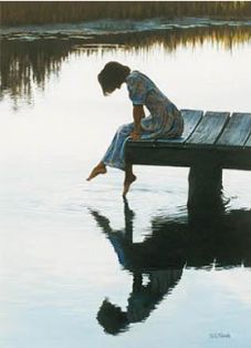 a person sitting on a bench in the water