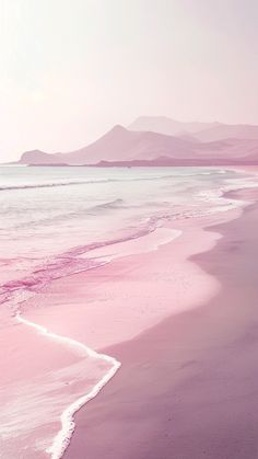 the beach is covered in pink sand and water