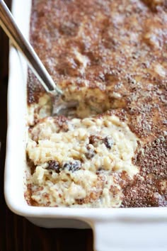 a casserole dish with oatmeal and raisins in it