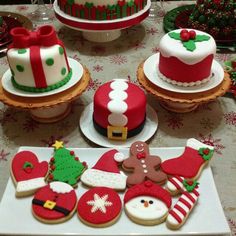 decorated christmas cookies and other holiday treats on a table