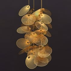 a gold chandelier hanging from strings with birds on it's wings and lights in the background