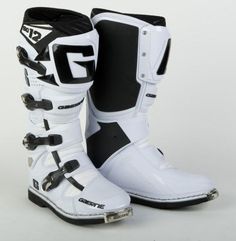 a pair of white and black boots with the word g3 on each boot side