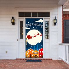 a christmas door cover with santa flying through the sky on his sleigh in front of a house