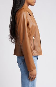 This sporty zip-front jacket is updated in a deep forest hue and crafted from sleek faux leather. 20" length Front zip closure Spread collar Long sleeves with zip cuffs Side zip pockets Water-resistant Lined 100% polyurethane Machine wash, tumble dry Imported Deep Forest, Faux Leather Jacket, Faux Leather Jackets, Toffee, Side Zip, Levi's, Zip Pockets, Top Brands, Water Resistant