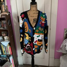 Vintage 1990's (Dated 1995) cardigan/sweater/jumper. The brand is *Eagle's Eye Collectibles*. Hand knit. Has ghost shaped White buttons down the front. The whole sweater is covered with a great Halloween theme. Leaves, pumpkins, witches, candy corn, ghosts, trick or treaters...etc...The *Eagle's Eye Collectibles* sweaters are known for their fabulous themed sweaters.  *SCROLL DOWN FOR CONDITION & MEASUREMENTS* CONDITION: I note some pilling here and there. Slight discoloration on the 4 pumpkins on the right sleeve cuff. MEASURES:  (Tagged size L=Large)  *Measured laying flat and UNstretched* Bust~44" Ribbed bottom~38" Sleeve length~26" Shoulder seam to shoulder seam~23" Back of collar to bottom~26 1/2" *WE APOLOGIZE~BUT WE NO LONGER SHIP TO GERMANY, ITALY OR SPAIN. IF ORDERS COME IN FROM G Trick Or Treaters, Halloween Sweater, Eagle Eye, Pumpkin Witch, Sweater Jumper, Halloween Theme, Trick Or Treater, White Button Down, Candy Corn