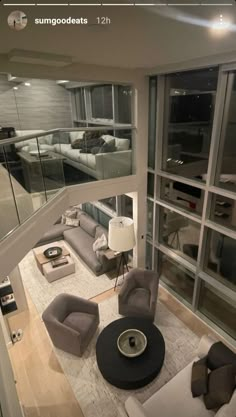 an aerial view of a living room with couches and chairs