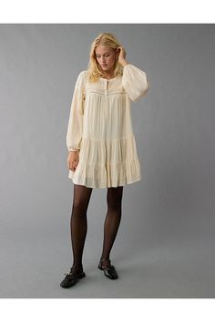 High neck with half button-up closure/Lacy inset details/Balloon sleeves/Tiered skirt Long Sleeve Cream Mini Dress For Daywear, Cream Long Sleeve Mini Dress For Daywear, Spring Mini Dress With Placket, Casual Bishop Sleeve Dresses For Daywear, White Jeans Men, Athletic Fit Jeans, Dream Jeans, Flowy Shirt, Boho Chic Dress