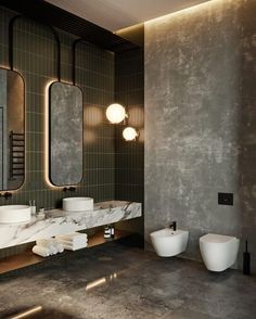 a bathroom with two sinks and three mirrors