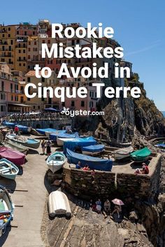 boats are lined up on the shore in cinque terre, italy with text overlay