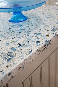 a blue cake plate sitting on top of a counter