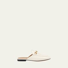 Gucci leather mule. 0.3" flat heel. Round toe. Bit-strap at vamp. Smooth outsole. Slide-on style. Made in Italy. Gucci Mule, Gucci Flats, Gucci Princetown, Travel Size Perfume, Gucci Horsebit, Gucci Leather, Loafer Mules, Leather Mules, Cleanser And Toner