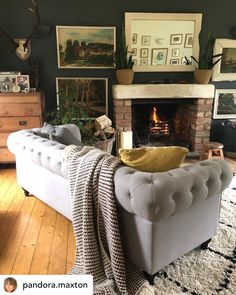 a living room with a couch, fireplace and pictures on the wall above it that reads pandana maxton