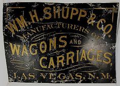 an old sign that says w h shipp & co manufacturers of wagons and carriages