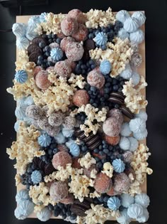 a cake made to look like popcorn and berries