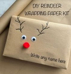 an envelope with a reindeer face on it and the words diy reindeer wrapping paper kit written below