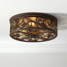 a light fixture in a room with white walls