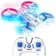 a remote control flying toy with lights on it's sides and the controller in front