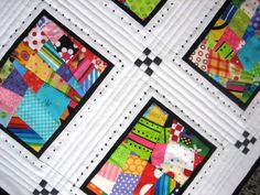 four square quilts with different patterns on them