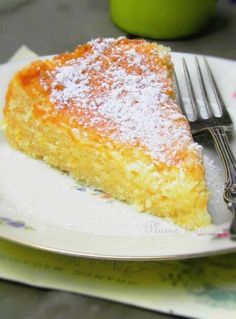 a piece of cake sitting on top of a white plate next to a knife and fork