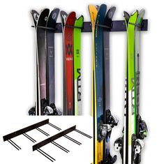 the skis are lined up and ready to be put into the rack for storage