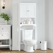 a white toilet sitting in a bathroom next to a shelf with towels on top of it