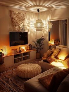 a living room filled with lots of furniture and lights on the wall above it's entertainment center