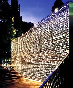 an illuminated wall on the side of a building