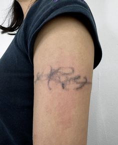 a woman with a tattoo on her arm