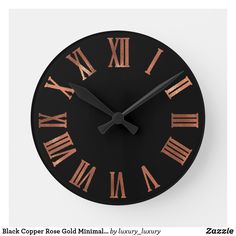 a black clock with roman numerals on the face and numbers are shown in two different colors