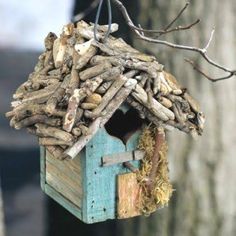 a bird house made out of wood sticks