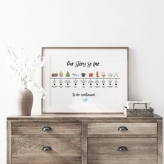 a wooden dresser with a white vase on top of it next to a framed poster