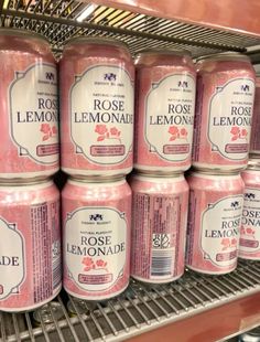 several cans of rose lemonade are on the shelf