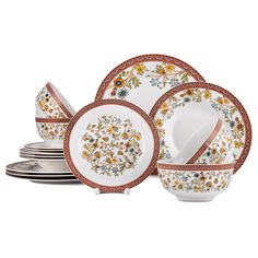 an assortment of dinnerware with floral designs