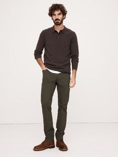 We updated our best-selling Traveler pant, keeping the same high-stretch comfort, but adding a more pronounced twill texture to the fabric.  Slim fit: Mid-rise.  Slim leg.  14" leg opening.  Organic: Made with certified, organically grown cotton that's easier on the earth.  Fabric from Italy's Olimpias mill.  Zip fly with button closure.  Belt loops.  Five-pocket styling.  Slim fit: Mid-rise.  Slim leg.  Leg opening: 14" Inseams: Short 30", Regular 32", Long 34" Model: Size 32x32, 6'2" (188cm). Mens Green Dress Pants, Green Pants Men, Slim Pants Men, Mens Office Wear, Green Dress Pants, Green Trousers, Banana Republic Jeans