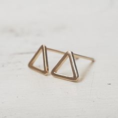 Small Triangle Stud Earrings,Gold Stud Earrings,Geometric Earrings,Minimalist,Open Gold Triangle Earrings,Dainty Earrings,Gift for herTiny triangle stud earrings . Dainty and delicate earringSimple and unique.Perfect as a giftMade from 14k gold filled or sterling silver stud earrings. Size- 8 mmThe earrings comes with butterfly backs.All my jewelry are packed in an elegant gift box.If you want to give it as a gift you can specify the address and I'll be happy to send it on your behalf.To see mor Triangle Stud Earrings, Triangle Earrings Stud, Gold Triangle, Stud Earrings Gold, Triangle Studs, Tiny Studs, Earrings Geometric, Tiny Stud Earrings, Gold Stud Earrings