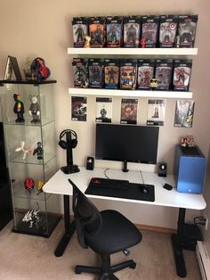 a desk with a computer on it in front of a book shelf filled with books