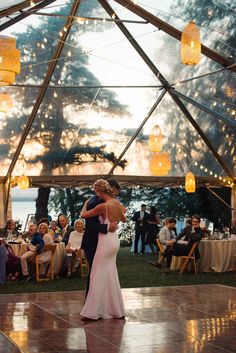 a bride and groom sharing their first dance