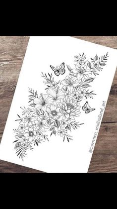 a black and white drawing of flowers on a piece of paper with butterflies flying around