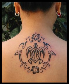 a woman with a turtle tattoo on her back