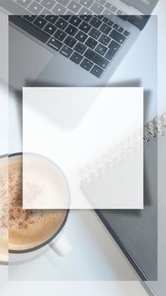 a laptop computer sitting on top of a white desk next to a cup of coffee