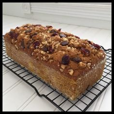 a loaf of bread sitting on top of a cooling rack