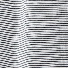 a black and white striped fabric with small dots on the top, as well as lines